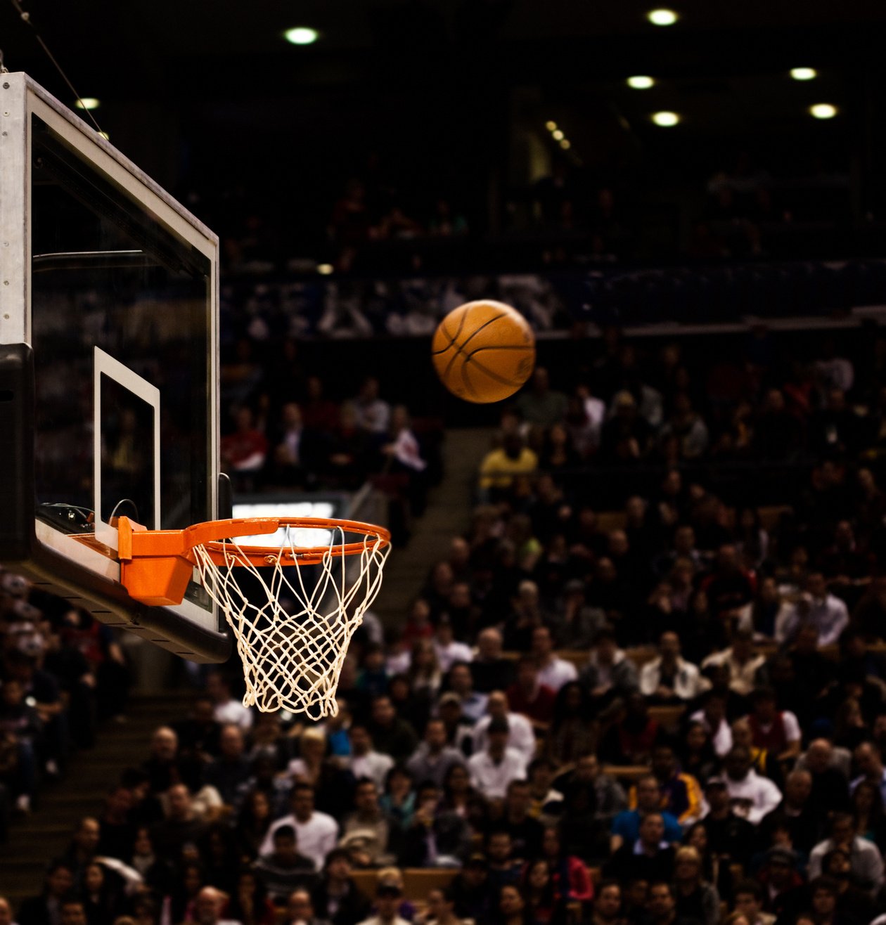 Basketball net with basketball near hoop